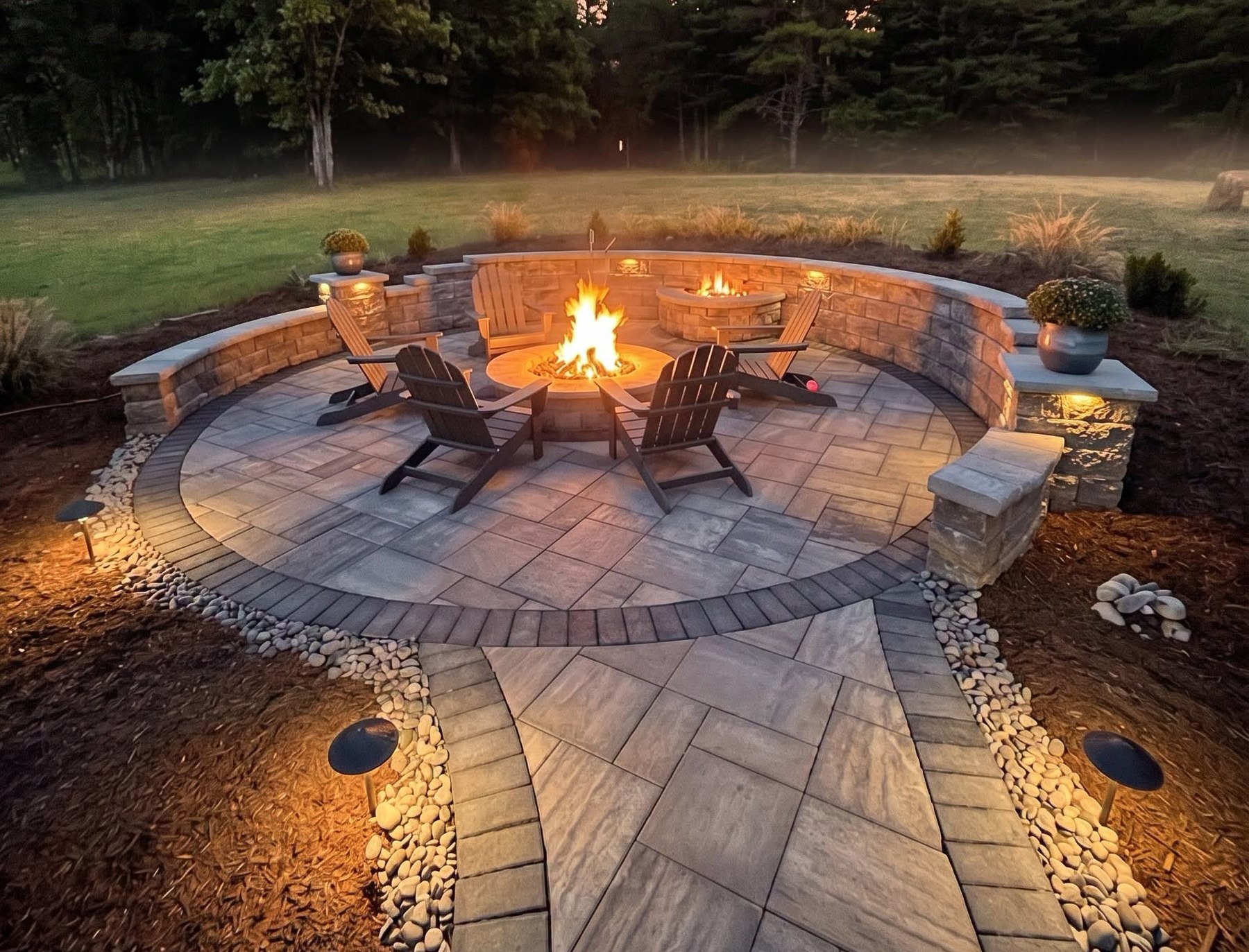 Custom paver patio with integrated landscape lighting built by Settlemyre Nursery