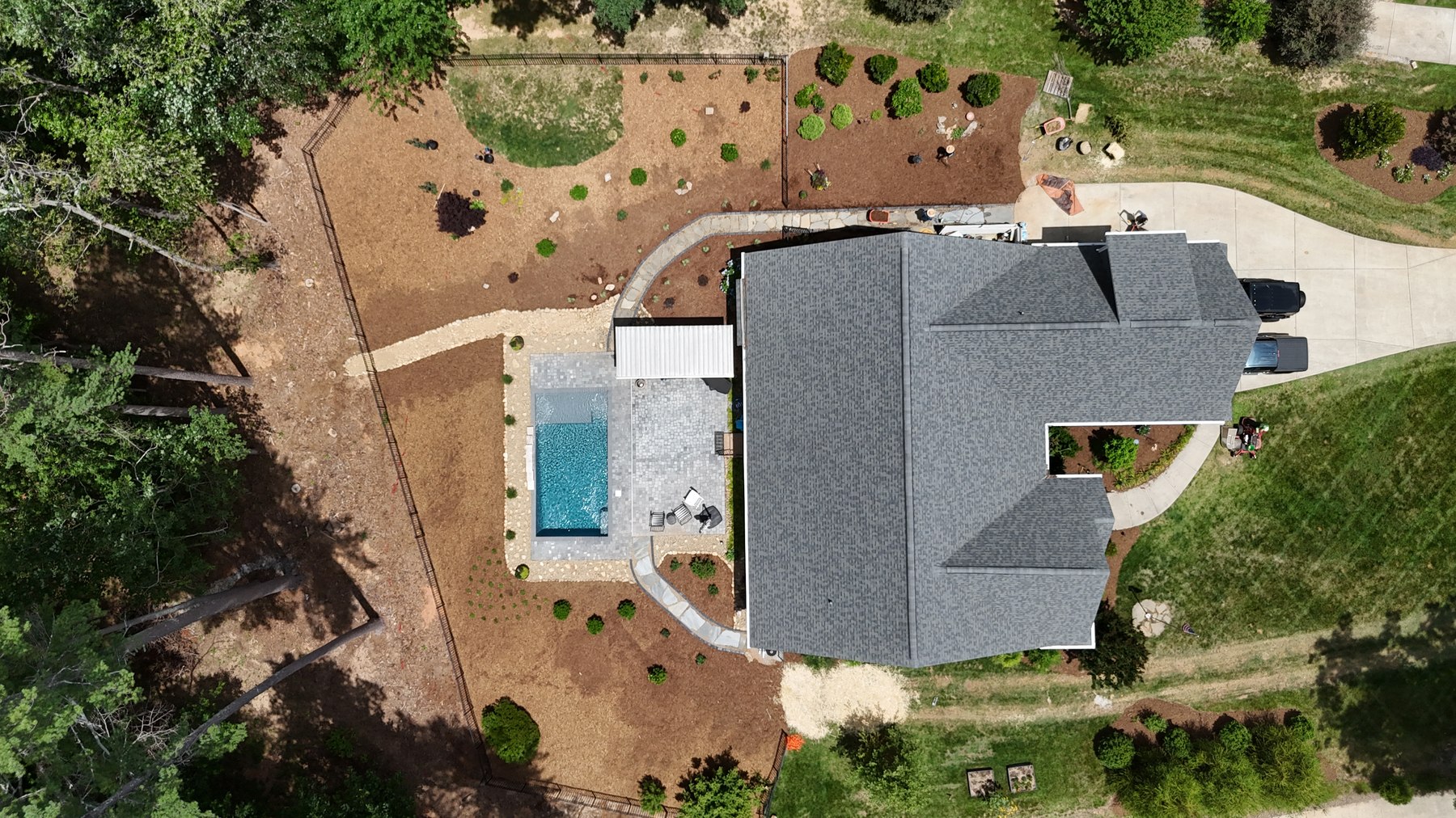 Aerial view of landscape beds and stone pathways with fresh mulch
